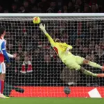 Penyelamatan Krusial David Raya Pastikan Arsenal Puncaki Klasemen Liga Inggris Penyelamatan Krusial David Raya Pastikan Arsenal Puncaki Klasemen Liga Inggris